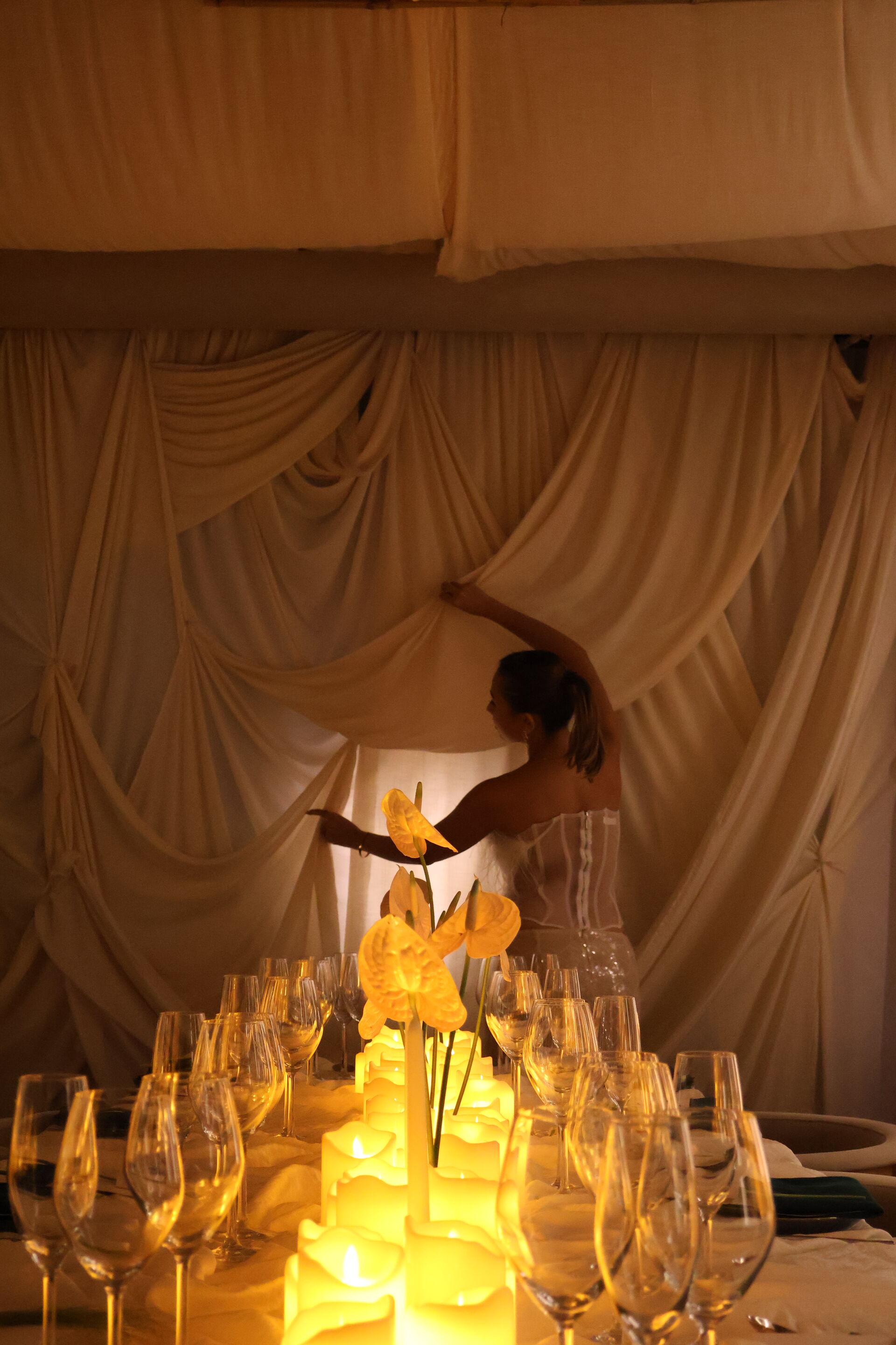 Candlelit tablescape with anthurium flowers