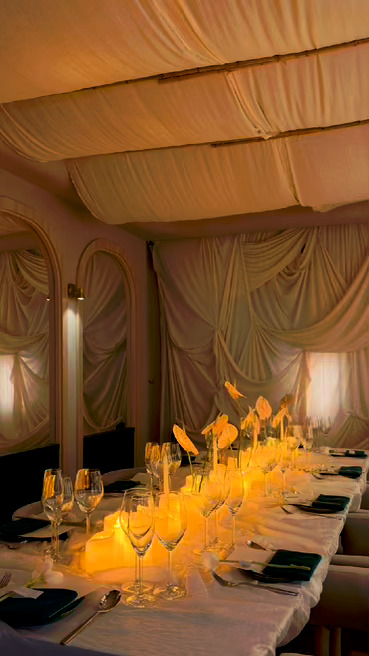 Warm candlelit fine dining table