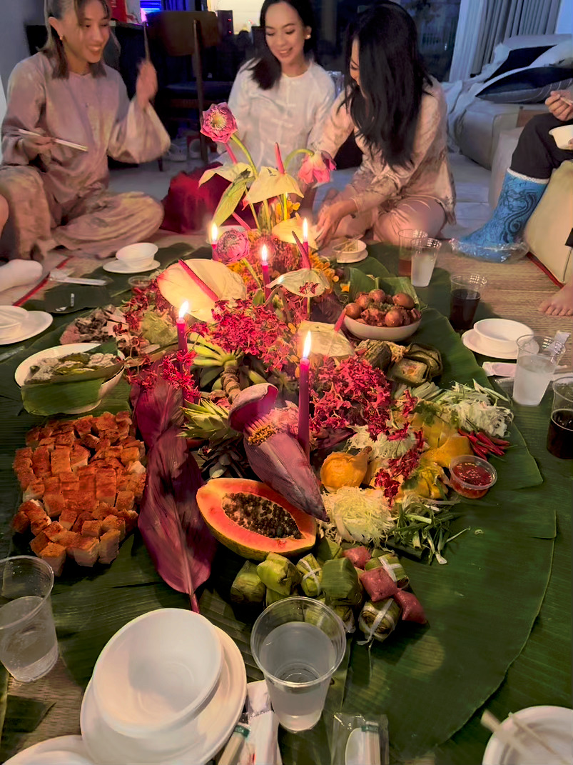 Banana leaf spread with tropical flowers